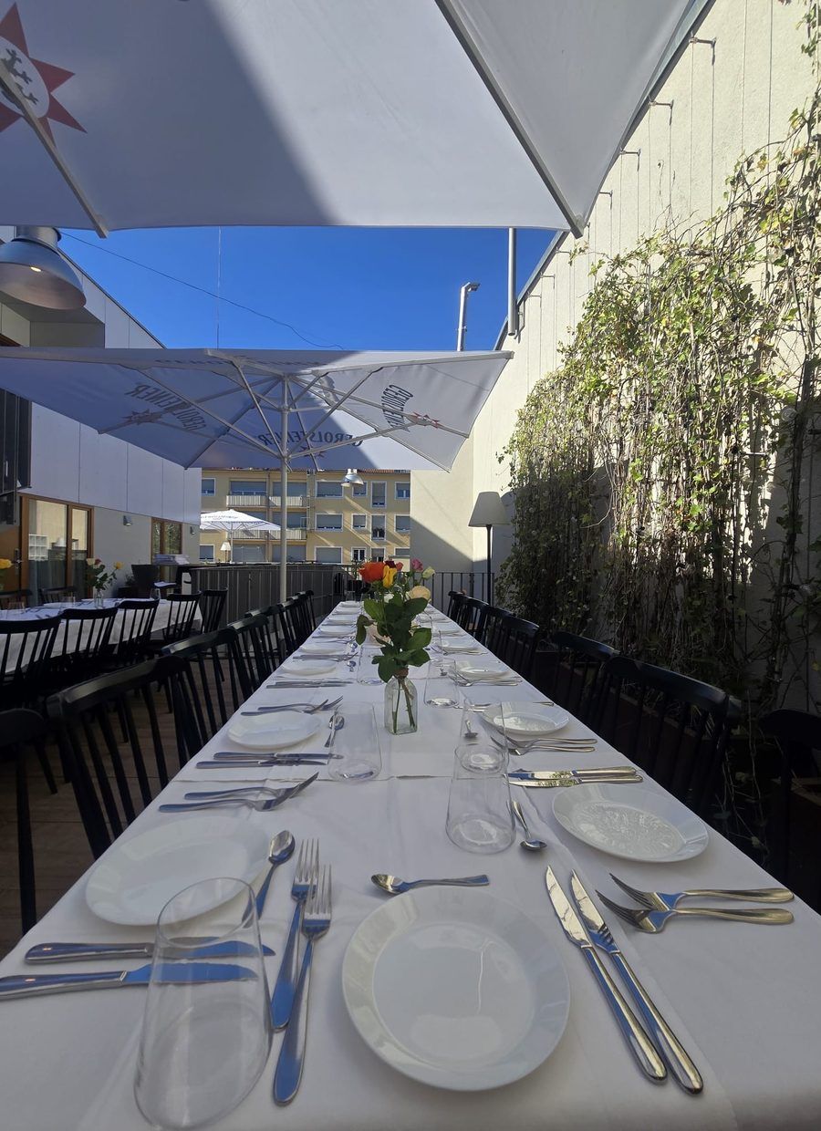 A long laid table on the roof terrace
